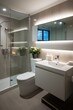 Modern bathroom interior with glass shower enclosure and white vanity