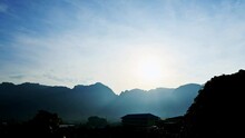 4K Time Lapse Of Dramatic Sunrise Over The Misty Valley Village. Amazing Light Of Nature Cloudscape Sky Over The Mountain. Footage Timelapse Of Beautiful Morning Scenery In The Nature Landscape.