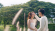 © ChayTee - Young adult fiance asia lover man and woman happy begin couple life hold two hands flirt sweet care touch. Asian people bride groom fall in love relax talk swear with trust hope on newlywed family day
