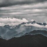 Fototapeta Na sufit - a view of cloudy with mountain peaks