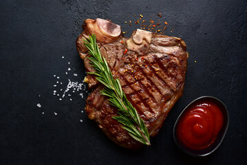 Wall Mural - Grilled T-bone beef steak. Top view with copy space.