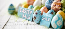 Easter Themed Sale Concept With Painted Eggs And Decorative Signs. Holiday Promotion.