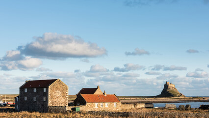 Wall Mural - Stunning dramatic landscape image of Lindisfarne, Holy Island in Northumberland England during Winter