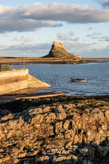 Wall Mural - Stunning dramatic landscape image of Lindisfarne, Holy Island in Northumberland England during Winter