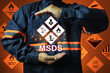 © AREE - MSDS chemical material safety data sheet concept with staff show warning signs of hazardous substances data to indicate emergency situation preparation for prevent potential dangerous