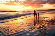 Peaceful Beach At Sunset, Where The Mother Holds Her Children's Hands As They Walk Along The Shoreline