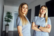 © Dasha Petrenko - Beautiful smiling female doctors in medical uniform stands near the window in clinic