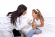 © nellas - Vaccine fear in children, Little girl in face mask in doctor's office is vaccinated. Crying, scared, afraid of syringe with vaccine  coronavirus ,flu, infectious diseases .Clinical trials of injection