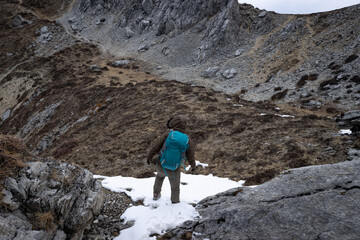 Wall Mural - Woman hiker hiking at mountain top in tibet