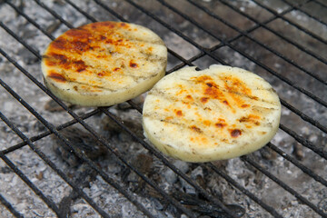 Sticker - Cheese being grilled in a garden