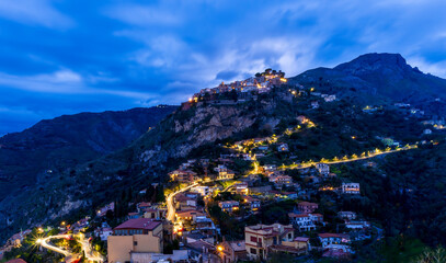 Wall Mural - Beautiful view of night town of Italy with colorful golden lights, night landscape on city of Europe