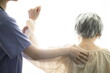 © 상은 신 - Physiotherapist stretching senior woman's arm
