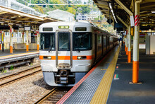Local Train Arrive To Railway Station Platform In Japan. Train Transportation Concept.