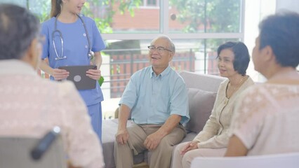 Wall Mural - Young Asian nurse come to join group of senior or elderly man and woman with happiness in room of clinic or healthcare center.