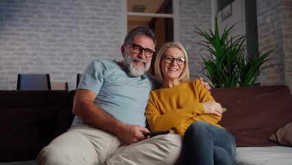 Poster - Happy senior couple watching Tv at home