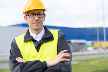 Poster - Portrait of engineer in helmet and glasses.