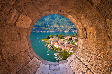 Wall Mural - Idyllic town of Torno on Como lake view through stone window