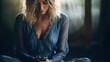 Beautyful young skinny woman with blonde hair in dark blue lace dress meditating,