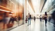 © sambath - Blurred background of a modern shopping mall with some shoppers.