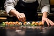 Photo of a sushi chef making hand rolls. Generative AI