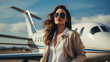 Mid adult plus size female businesswoman and private jet at airport