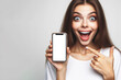 happy woman with Huge Eyes surprised expression hold smartphone with white mockup screen. ai generative