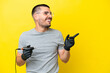 Tattoo artist caucasian man isolated on yellow background intending to realizes the solution while lifting a finger up