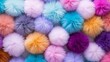 A view of pom poms that are both colorful and fluffy at the top.