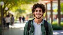 Smiling Young Male College Student With Curly Hair And A Backpack