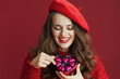 happy stylish female in red sweater and beret