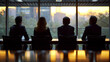 four executives sitting at a table with backlight