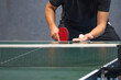 table tennis player serving in a table tennis championship match
