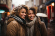 wo beautiful women on a snowy day pose embraced as good friends or an interracial lesbian couple in winter
