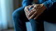 © DB Media - Man hand holding his knee, knee pain concept