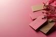 close up of pink and brown price tags on pink background with copy space