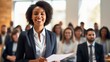 © Krtola  - African young business woman in front of a group