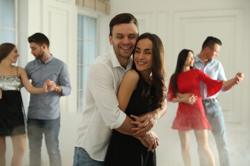 Canvas Print - Lovely young couple dancing together at party