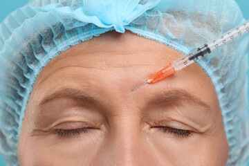 Sticker - Senior woman getting facial injection, closeup. Cosmetic surgery