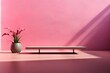 pink background with a plant and a podium
