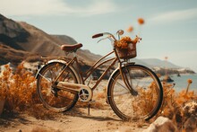 Vintage Bicycle Parked On A Beach With A Flower Basket On The Handlebars