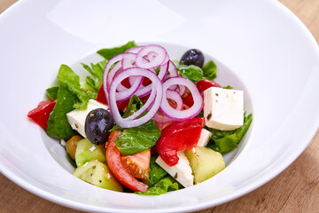 Wall Mural - greek salad on the white plate