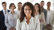 © Rax Qiu - A Confident Businesswoman Standing In Front Of Her Professional Business Team