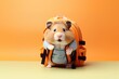 A schoolboy hamster with a backpack on yellow orange background.