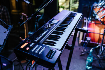 synthesizer close-up. concert in a bar. live music. electronic musical instrument.