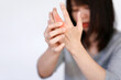 © Oporty786 - Woman has finger joint pain due to rheumatoid arthritis. Health care concept.