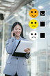 © NINENII - Happy Client customer experience concept. Woman recording phone inquiry with checkboxes, smiling face rating excellent for satisfaction survey.
