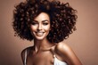 © MuhammadQaiser - Fashion studio portrait of beautiful smiling woman with afro curls hairstyle. Fashion and beauty