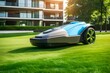 Automatic robotic lawn mower moving on green lawn near modern residential apartment building houses. Automated smart grass lawn mower robot working in sunny summer day. Urban city background