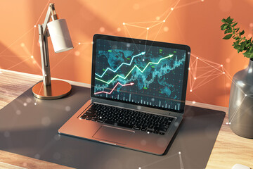 Poster - Close up of desktop with lamp, vase and growing forex chart on laptop screen. Orange wall background. Financial growth, money and success concept. 3D Rendering.