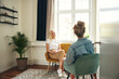 © Flamingo Images - Smiling psychologist listening to a client